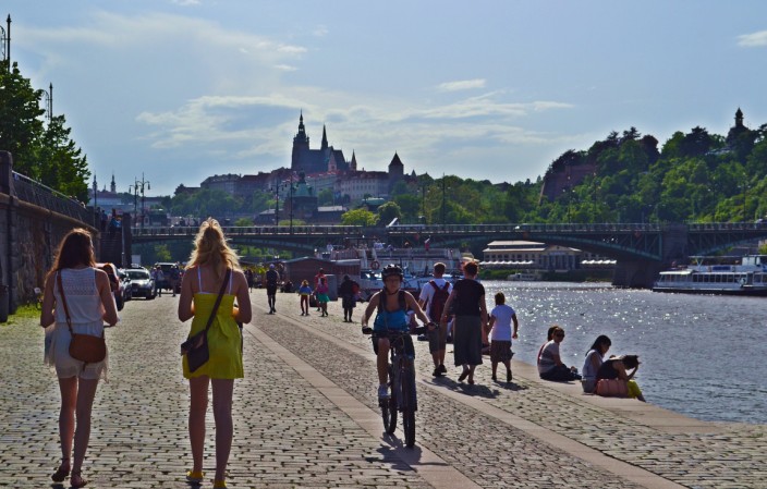 Strolling the banks of the Vltava River, Prague Castle in background